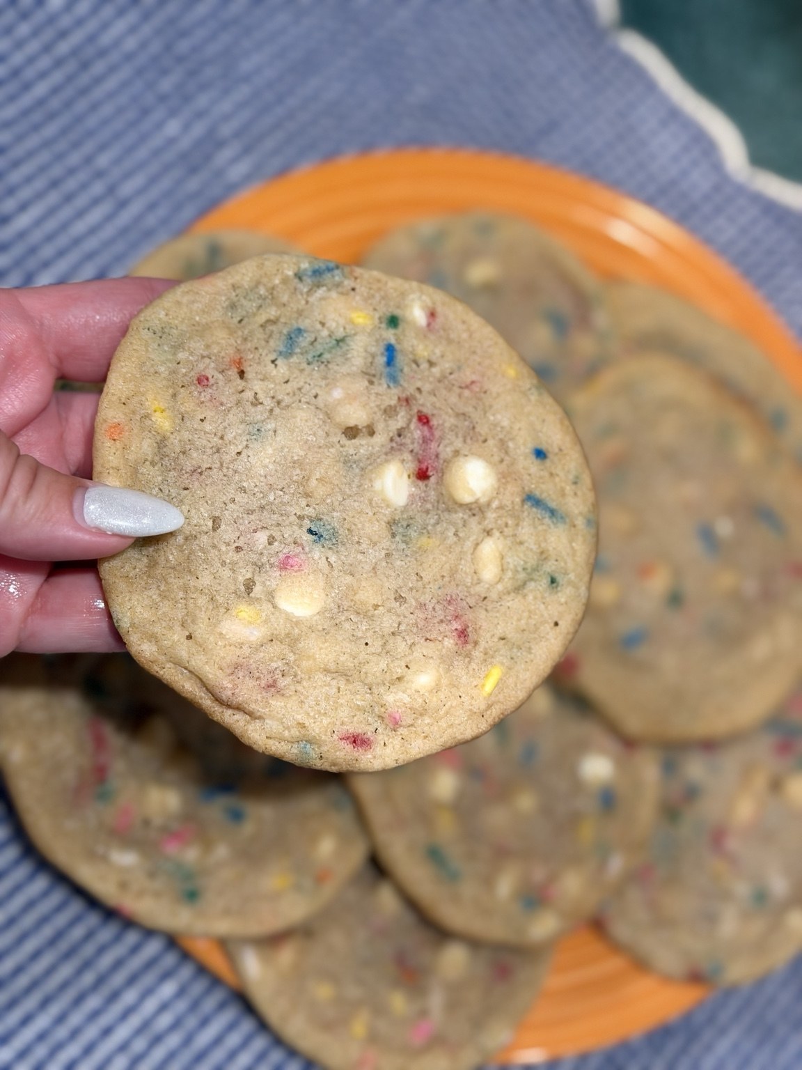 Funfetti cookie held in hand